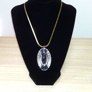 Goldtone chain with see through pendant